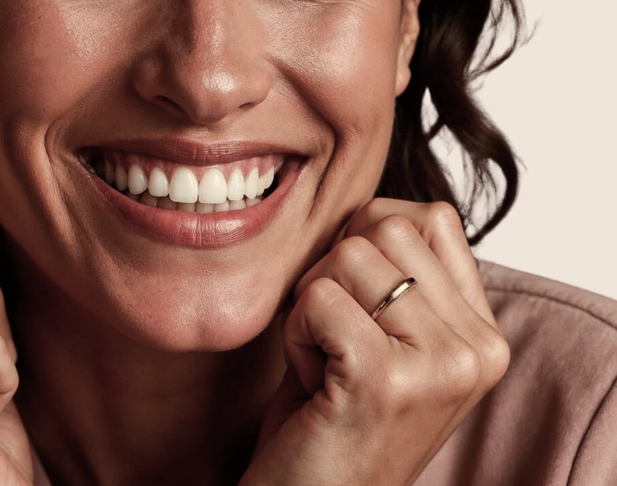 Smiling person showcasing a bright, healthy smile, representing cosmetic dentistry services for smile enhancement at SoCal Prime Dentistry.