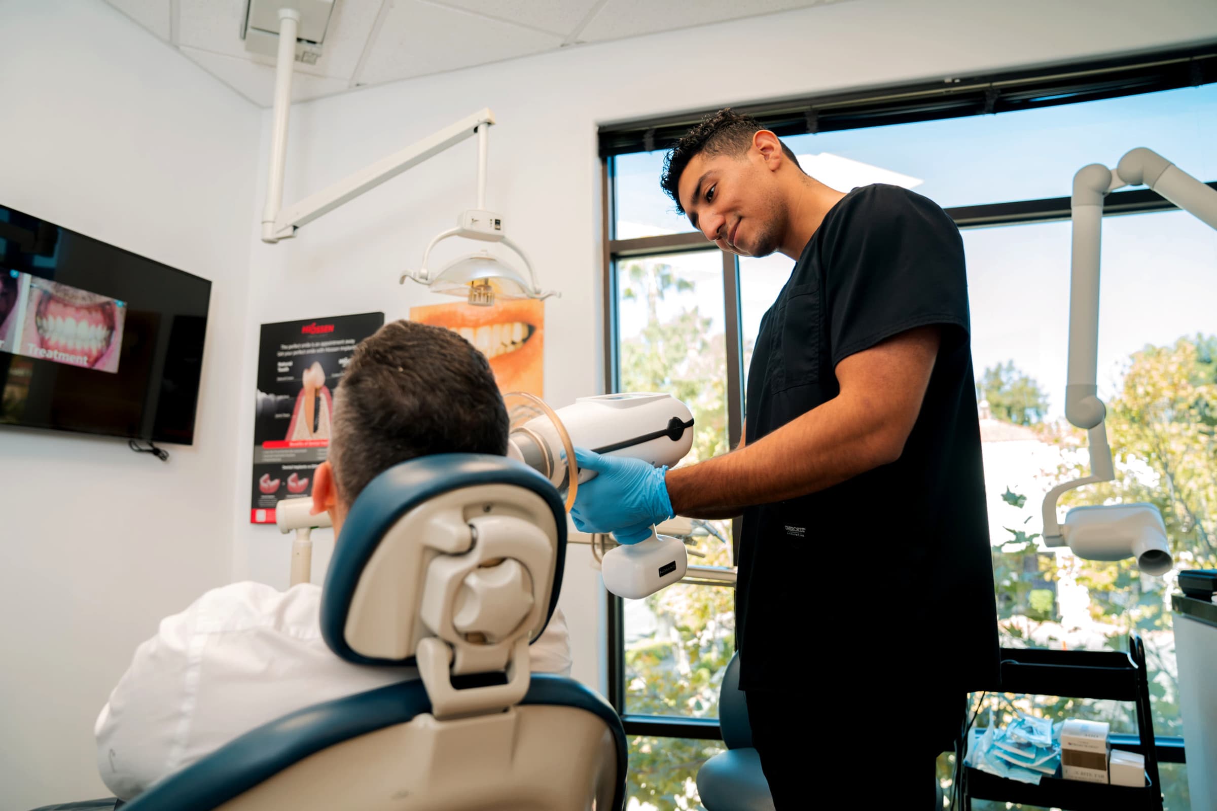 Dental professional providing care in a modern dental office, emphasizing personalized treatment and patient comfort at SoCal Prime Dentistry.