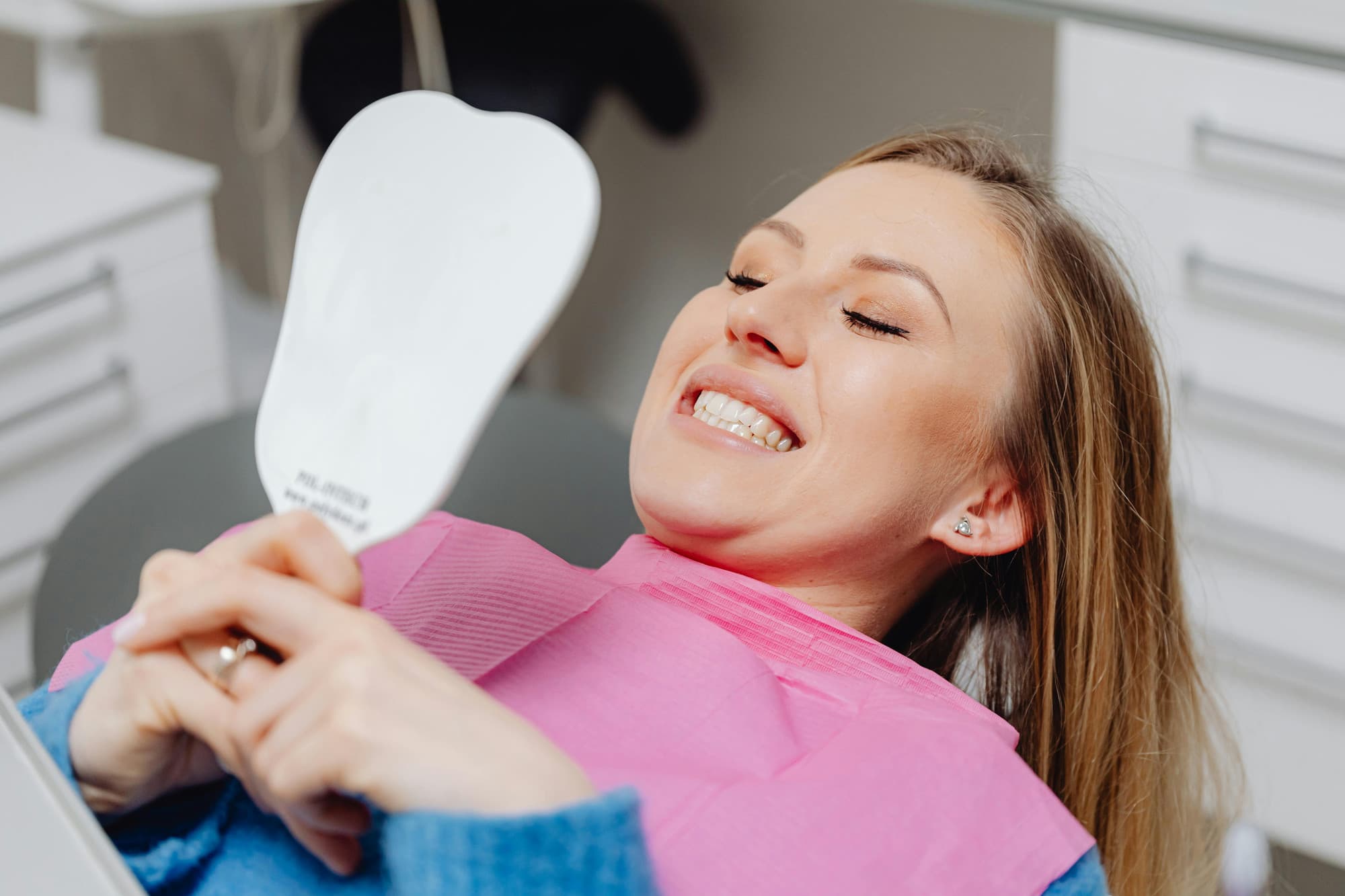 Patient smiling after porcelain veneers treatment at SoCal Prime Dentistry in Rancho Santa Margarita, CA